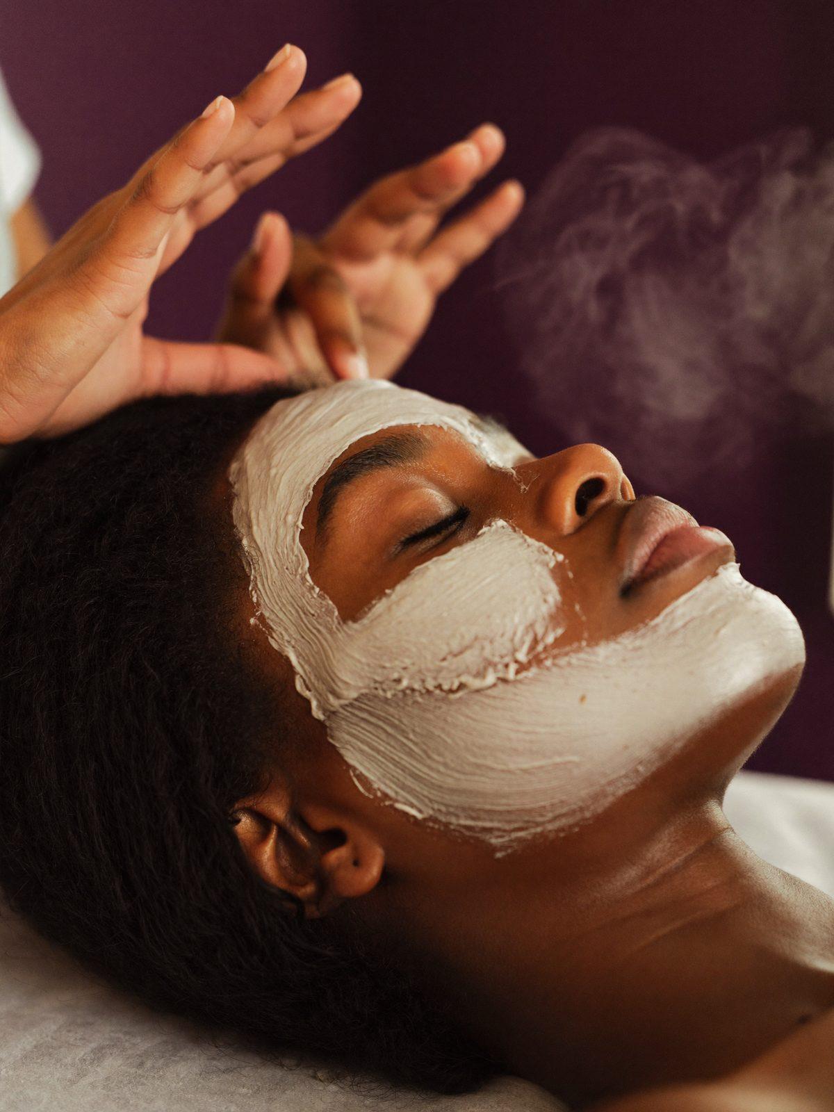 A guest receiving a facial treatment